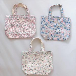 Detailed set of three cotton canvas tote bags with floral and polka dot patterns