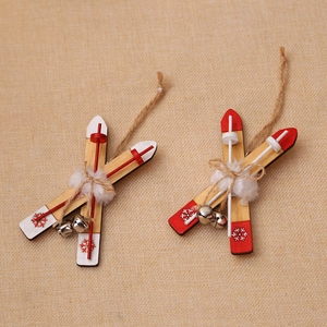 Handcrafted wooden sled Christmas tree ornaments with white snowflakes and bells