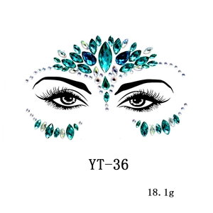 Macro view of blue-green acrylic face gems YT-36 showing symmetrical teardrop shapes