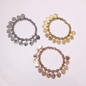 Chunky stainless steel chain bracelets with heart charms in gold, silver, and rose gold
