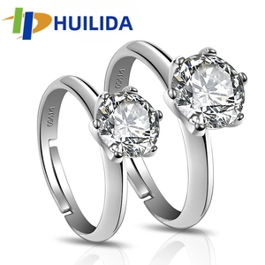 Detail showing PT950 hallmark on six-prong set cubic zirconia adjustable rings
