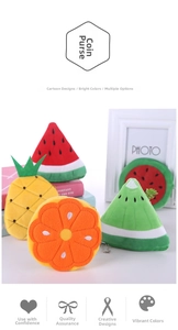 Detailed view of plush fruit coin purses featuring watermelon and pineapple with keychains