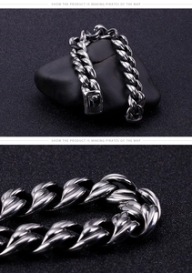 Macro detail of industrial style silver stainless steel link chain with textured facets