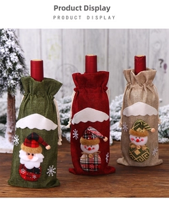 Three burlap Christmas wine bottle bags with plush Santa and snowman holiday characters