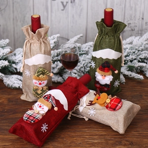 Three Christmas burlap wine bottle bags featuring 3D Santa, snowman, and reindeer figures