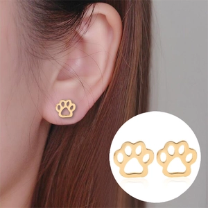Cute hollow cat paw print stud earrings in polished gold finish for women