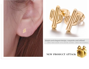 Close-up of minimalist gold cactus stud earrings featuring matte finish and hollow design