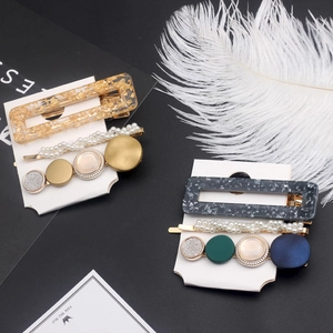 Elegante set de pinzas para el cabello en resina mármol gris y dorado con perlas