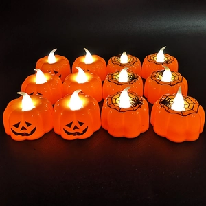Halloween LED pumpkin candle lights with spider web patterns, 12-pack festive decor