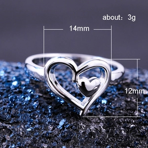 Polished silver double heart open ring featuring a minimalist cutout design for women