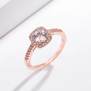 Close-up of rose gold halo ring featuring a round zircon center and pavé band
