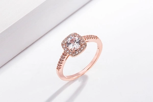 Macro detail of rose gold ring featuring S925 mark and sparkling halo setting