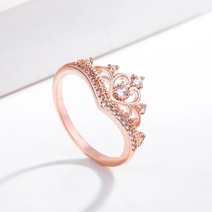 Macro shot of rose gold crown ring featuring heart-shaped cutouts and sparkling zircons
