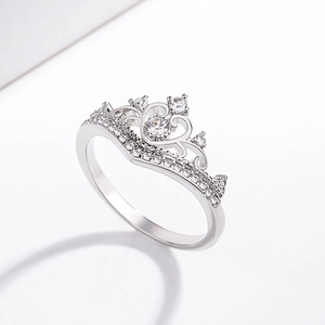 Macro detail of the crown-shaped ring with brilliant-cut cubic zirconia in 18K white gold plating