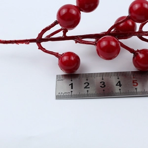 Close-up of 1cm diameter red foam berries with glossy finish and realistic texture