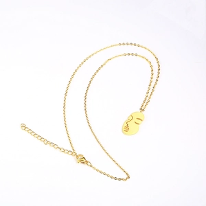 Abstract face pendant necklace in 18K gold plated titanium steel for women fashion