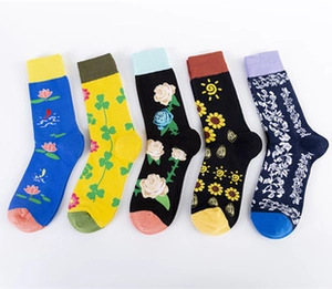 Detail of five-pair cotton socks set featuring floral jacquard patterns and ribbed cuffs