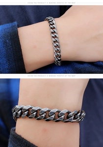 Macro view of vintage silver cuban chain bracelet showing flat links and polished finish
