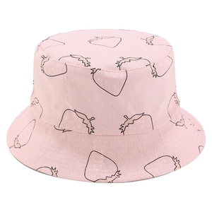 Detailed close-up of pink canvas bucket hat with minimalist strawberry embroidery texture