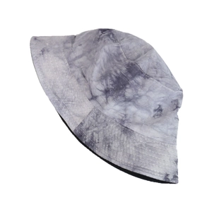 Detailed macro shot of grey and white tie-dye cotton fabric on bucket hat brim