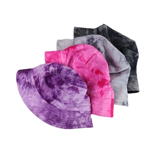 Detail showing tie-dye patterns and multi-row stitching on bucket hats in various colors