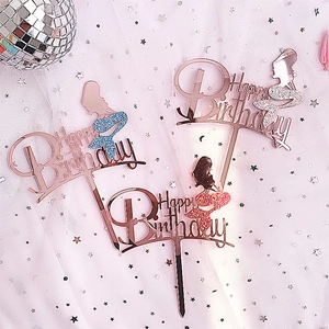 Close-up of laser acrylic happy birthday cake toppers with glitter mermaid silhouettes