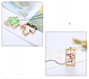 DIY resin jewelry pendants featuring maple leaf and geometric shapes in gold frames