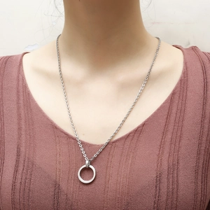 Hip hop style silver stainless steel necklace with double circle pendant on a model
