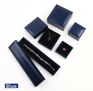 Blue textured jewelry gift box set with plush black interior for rings and necklaces