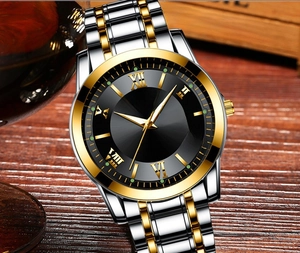 Detailed close-up of ORUSS gold-tone watch with black dial and dual calendar window