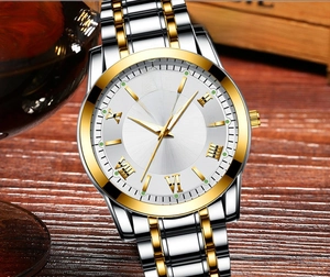 Close-up of ORUSS men's quartz watch with calendar display and gold steel band