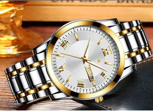 Macro detail of men's quartz watch with dual calendar, gold markers and steel band