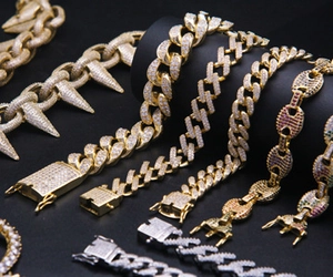 Detailed view of 18K gold and silver plated hip hop Cuban chains with zircon stones