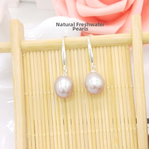 Detailed view of S925 silver hooks with natural pink freshwater pearl earrings