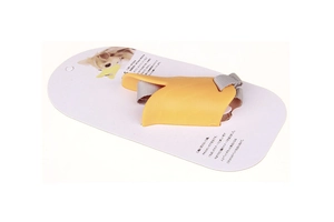 Detailed view of yellow duck-shaped silicone muzzle with adjustable strap and packaging