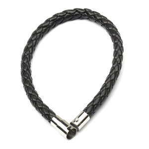 Detail of black woven leather cord bracelet with silver magnetic cylindrical clasp