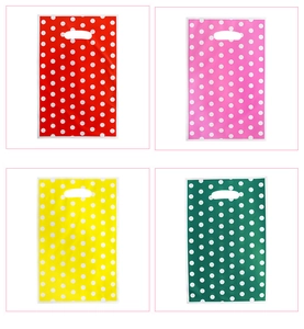 Detailed grid view of pearlized plastic gift bags with white polka dots and handles