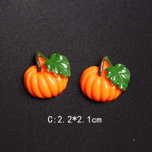 Detailed view of Halloween resin pumpkin charms measuring 2.2cm x 2.1cm for DIY crafts
