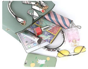 Top view of mint green handbag showing large capacity with iPad, umbrella, and daily items