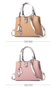 Detail showing khaki and rubber pink tote bags with checkered scarves and metal charms
