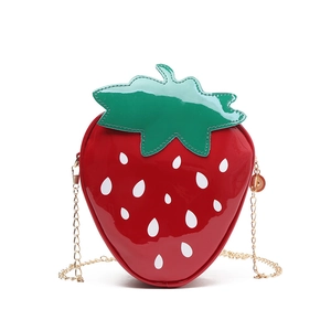 Cute strawberry shaped crossbody bag with red glossy finish and gold metal chain strap