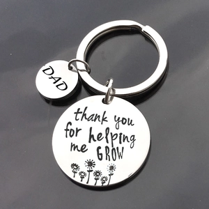 Stainless steel Father's Day keychain with engraved 'Thank you for helping me grow' quote