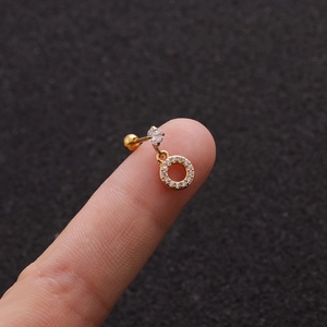 Close-up of a gold-plated stainless steel cartilage stud earring with cubic zirconia