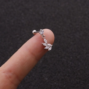 Detail of silver leaf cartilage earring with micro-p鑲 ziconia studs on a stainless base