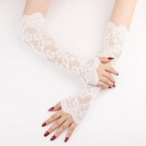 Close-up detail of white lace sun protection sleeves with intricate floral mesh patterns