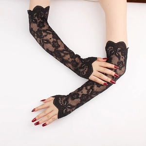 Close-up of elegant black floral lace arm sleeves with fingerless design and wavy edges