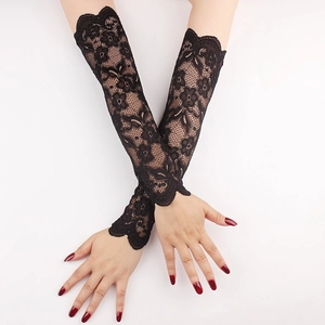 Close-up of long black lace sun protection sleeves with elegant floral mesh patterns