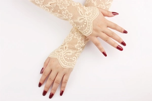 Detailed view of beige floral lace arm sleeves for UV protection and bridal style