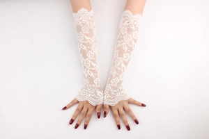 Detailed view of white floral lace long fingerless gloves with elegant scalloped edges