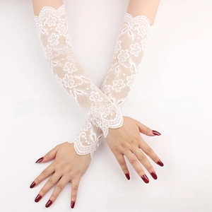 Detailed macro view of white floral lace sun protection arm sleeves with scalloped edges